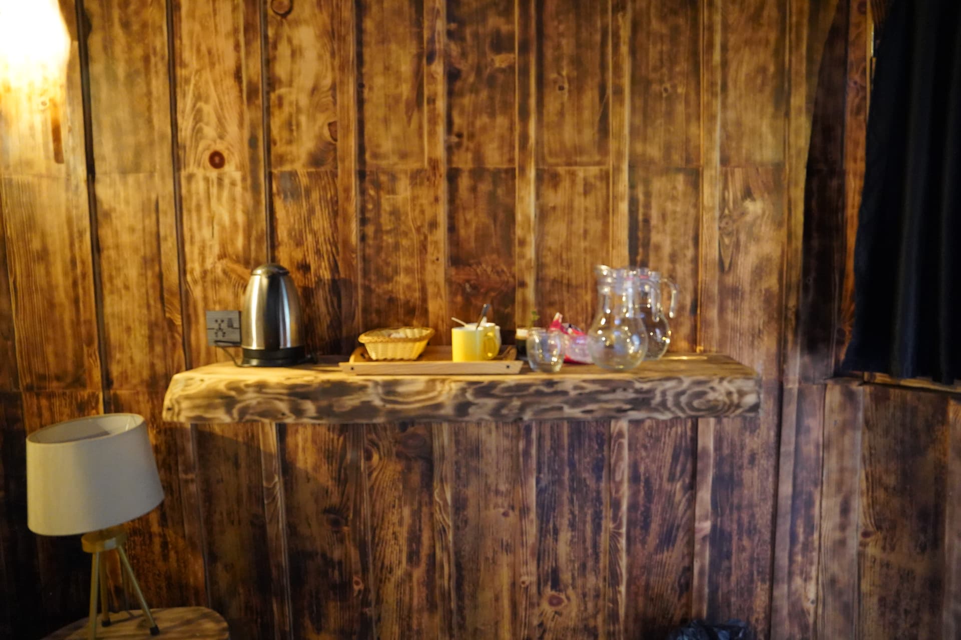Rustic wooden counter with tea service
