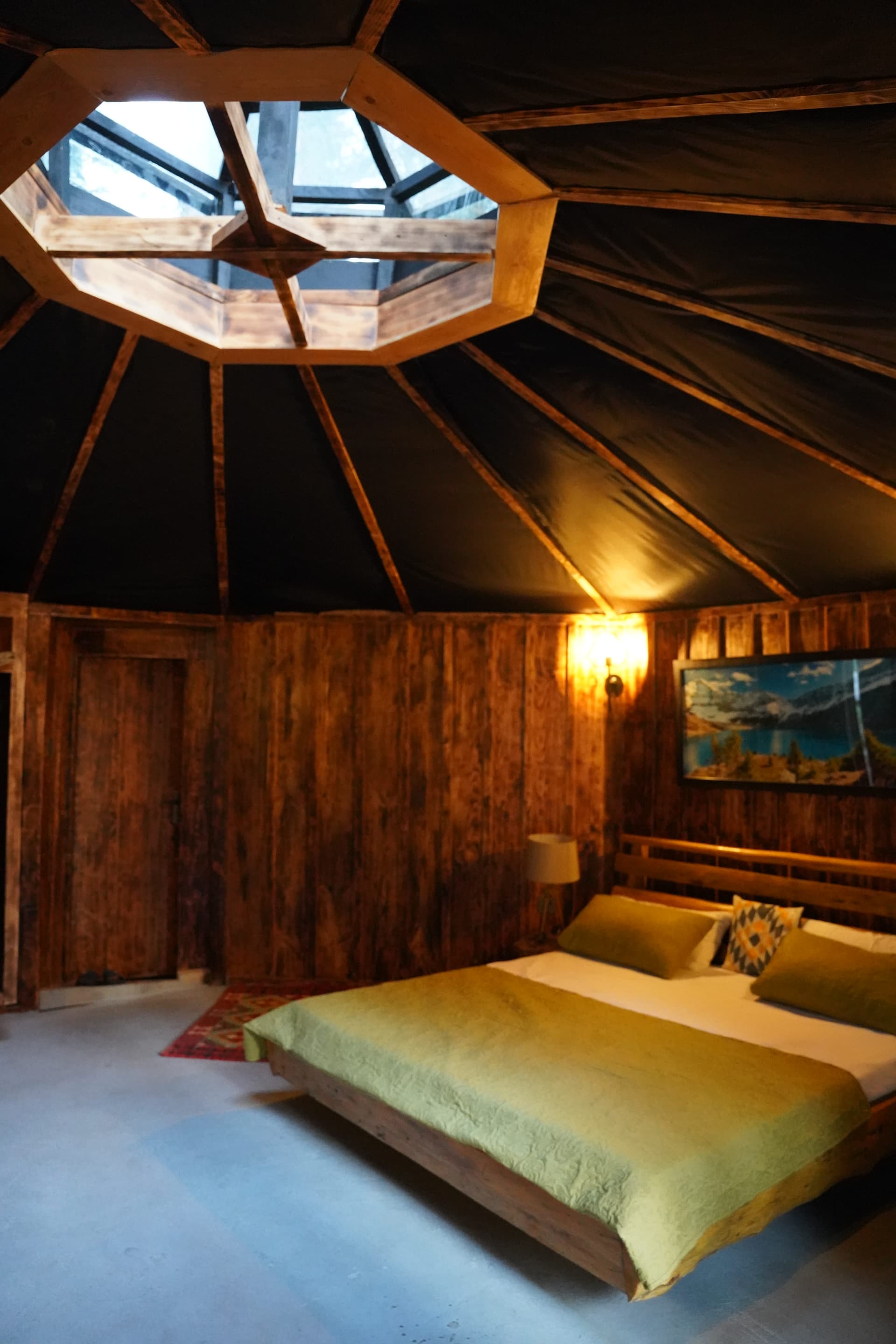 Octagonal skylight bedroom with wooden walls