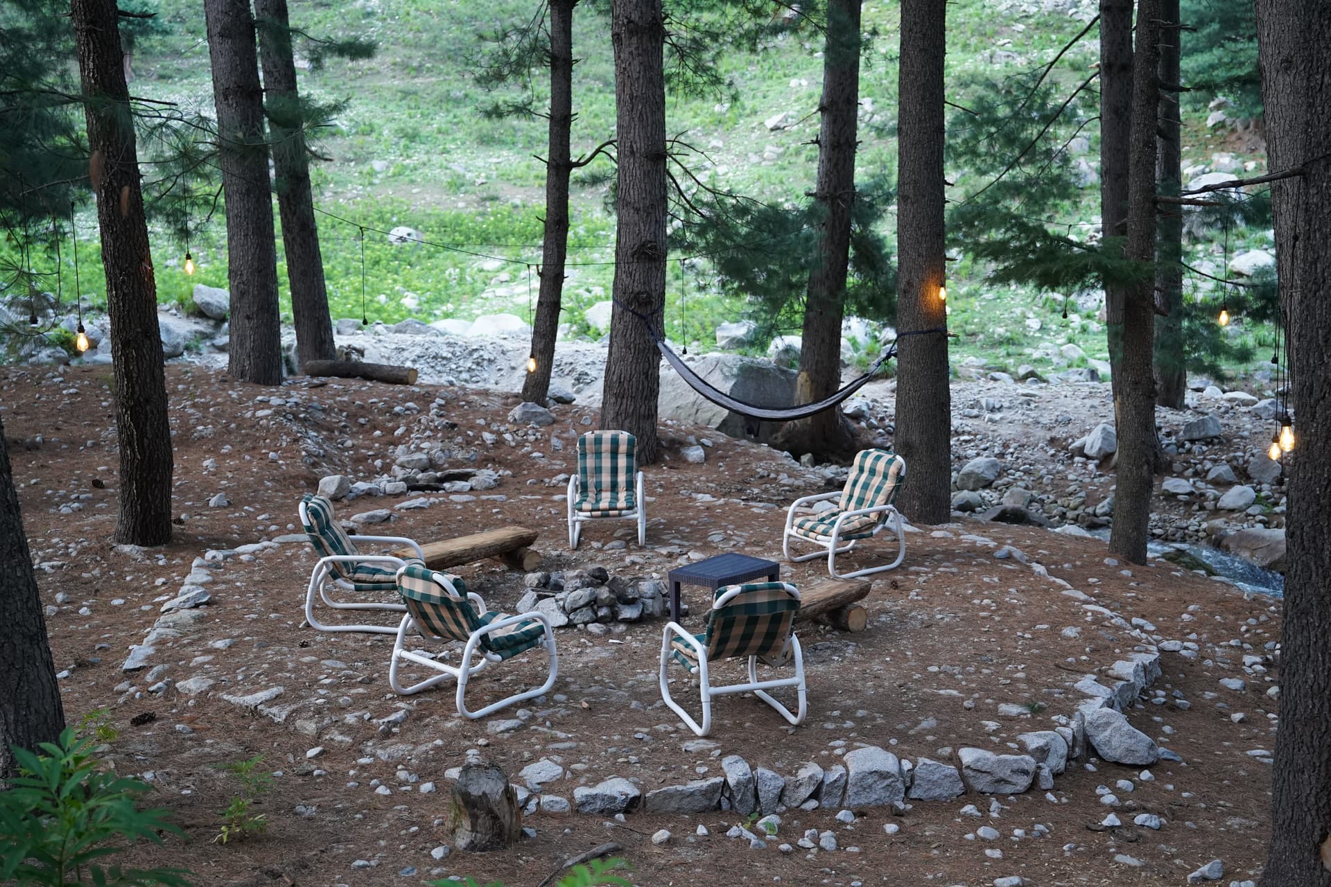Outdoor campfire area by the stream