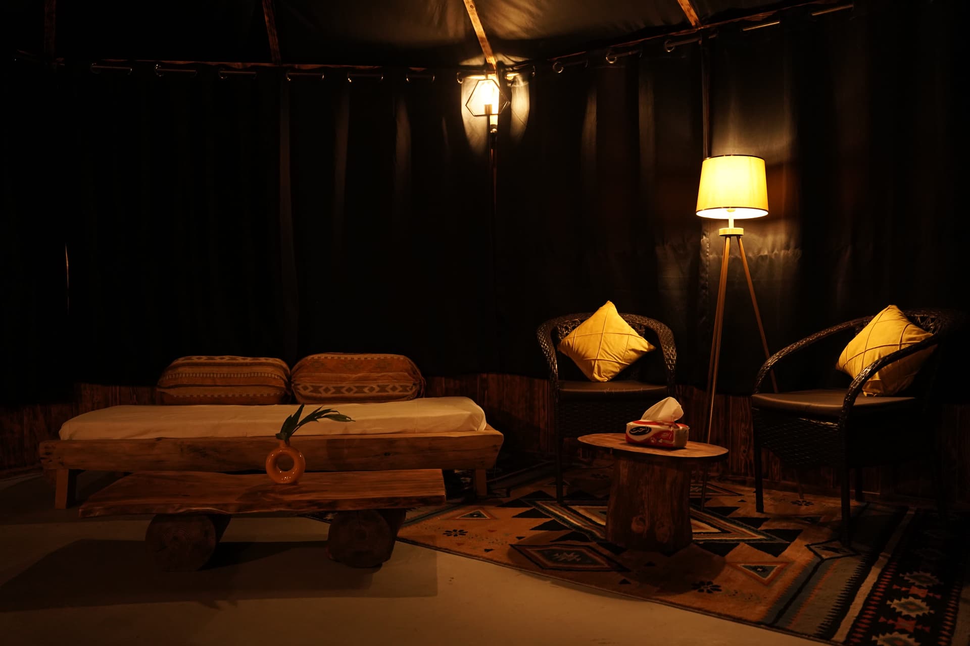 Lounge area with wicker furniture and warm lighting