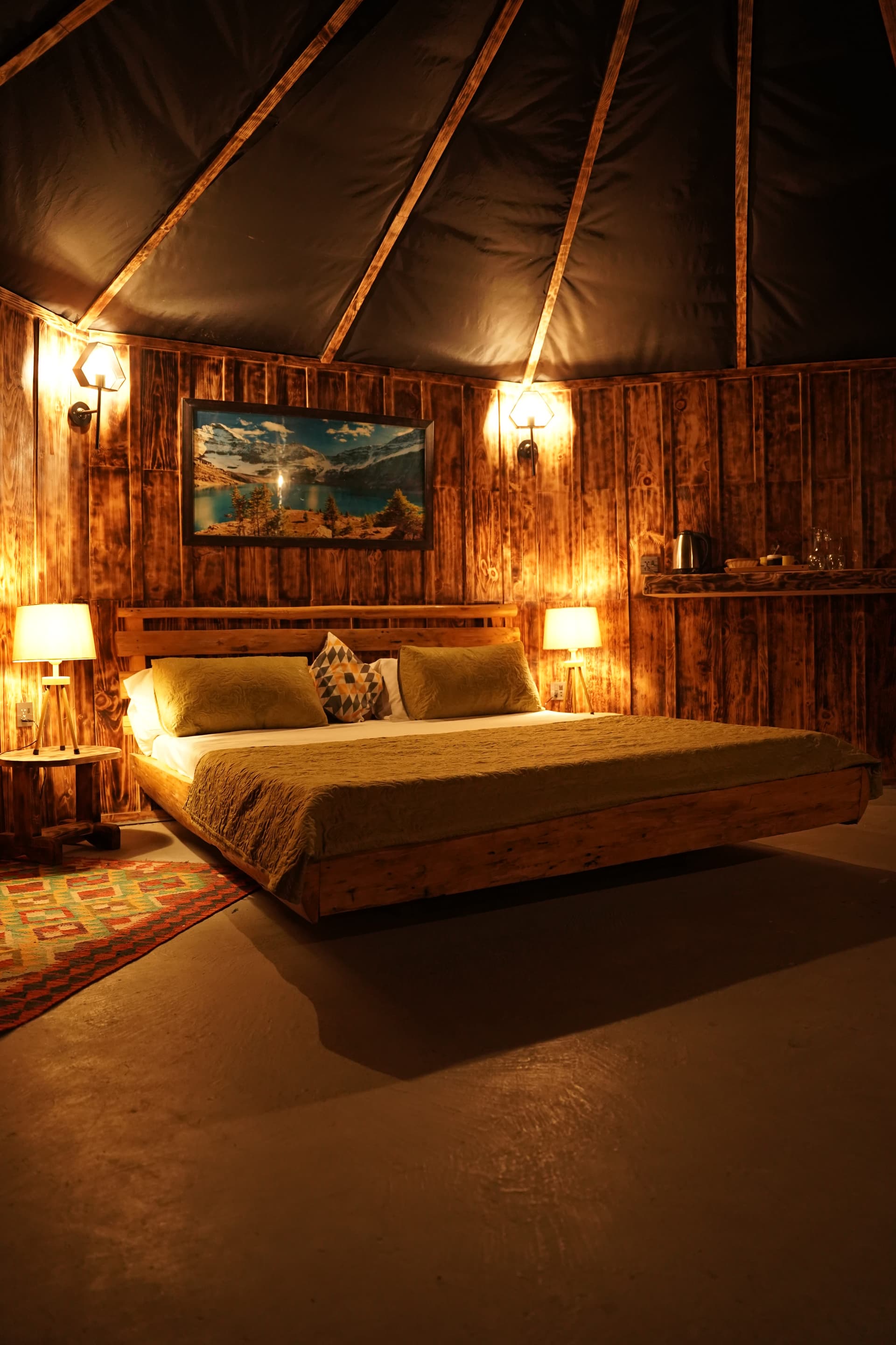 Spacious bedroom with vaulted ceiling and warm ambiance