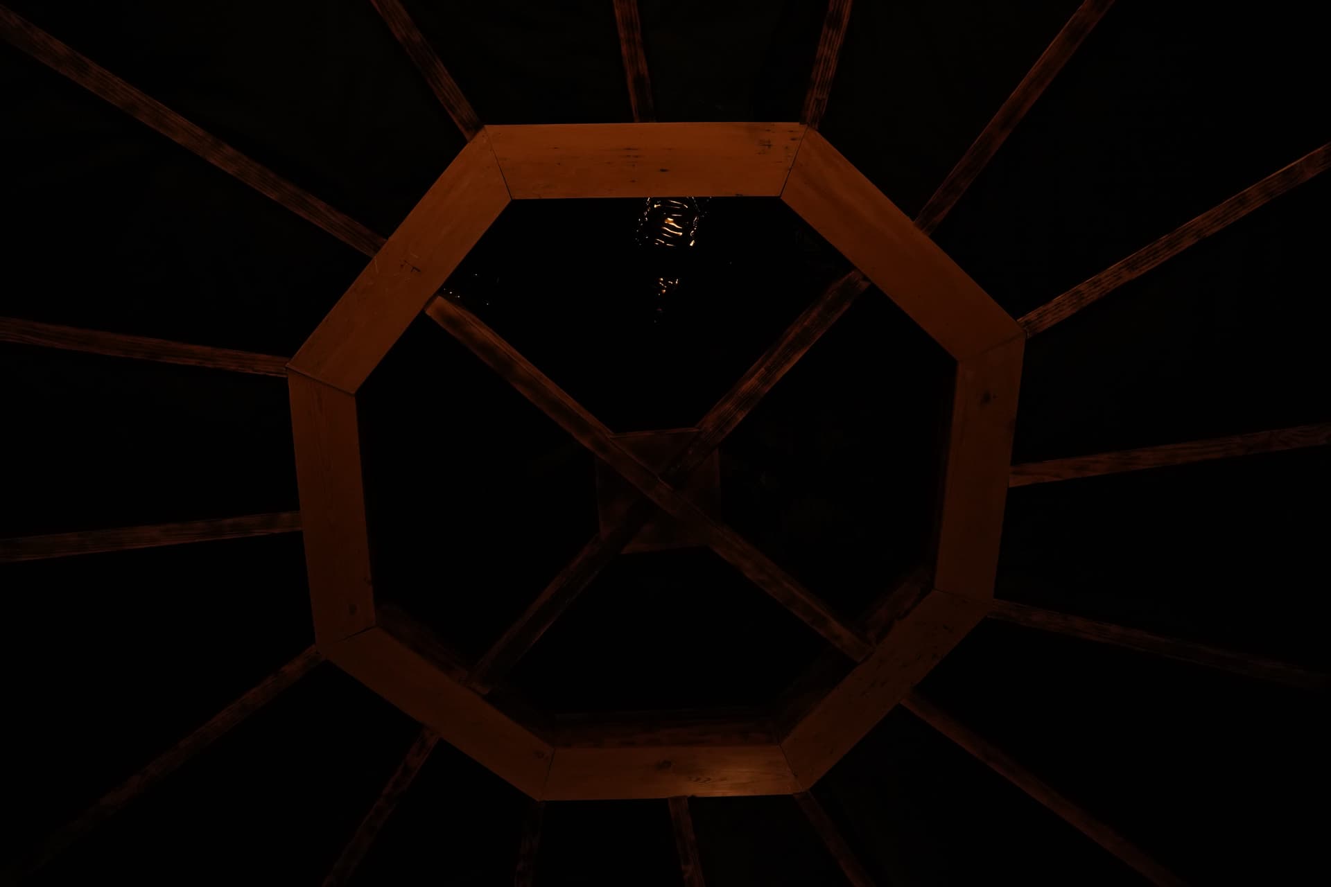 Octagonal wooden skylight at night